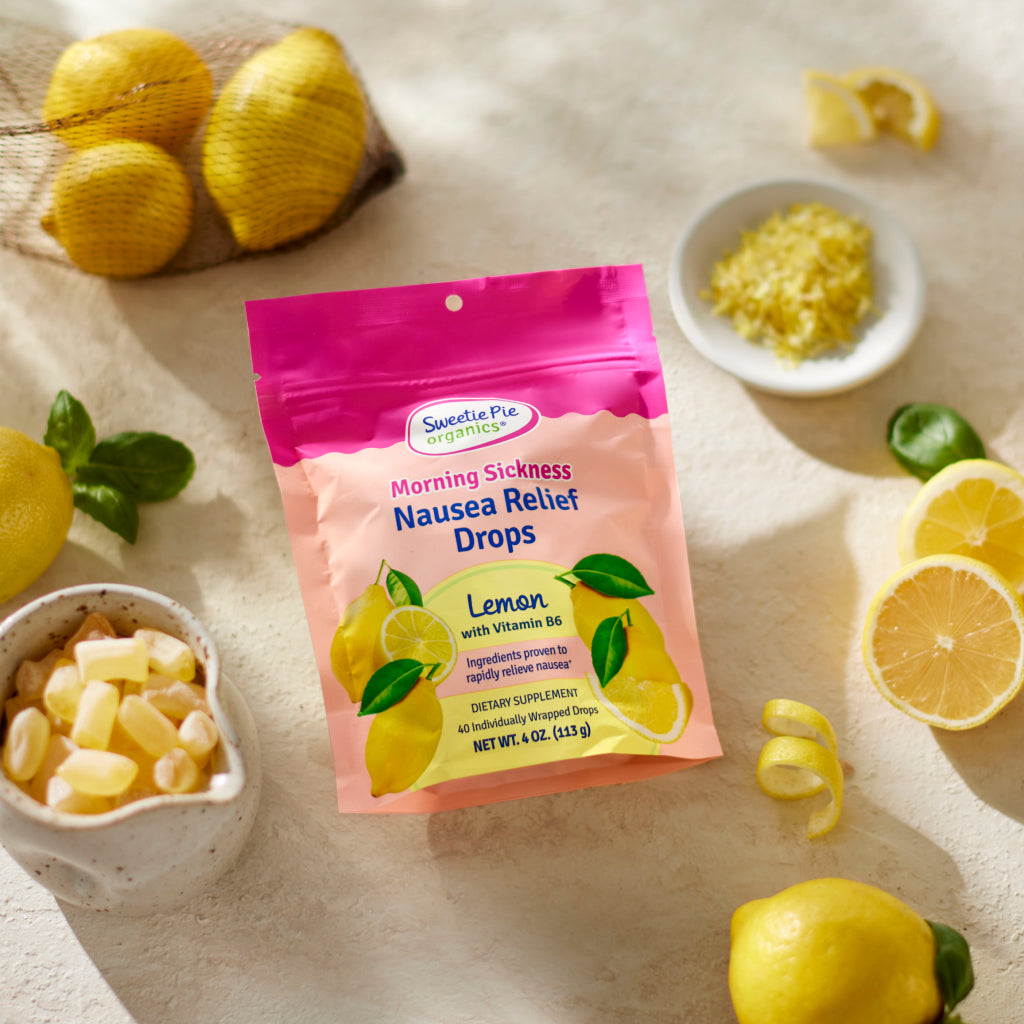 image of lemon nausea relief drops with fresh lemons 