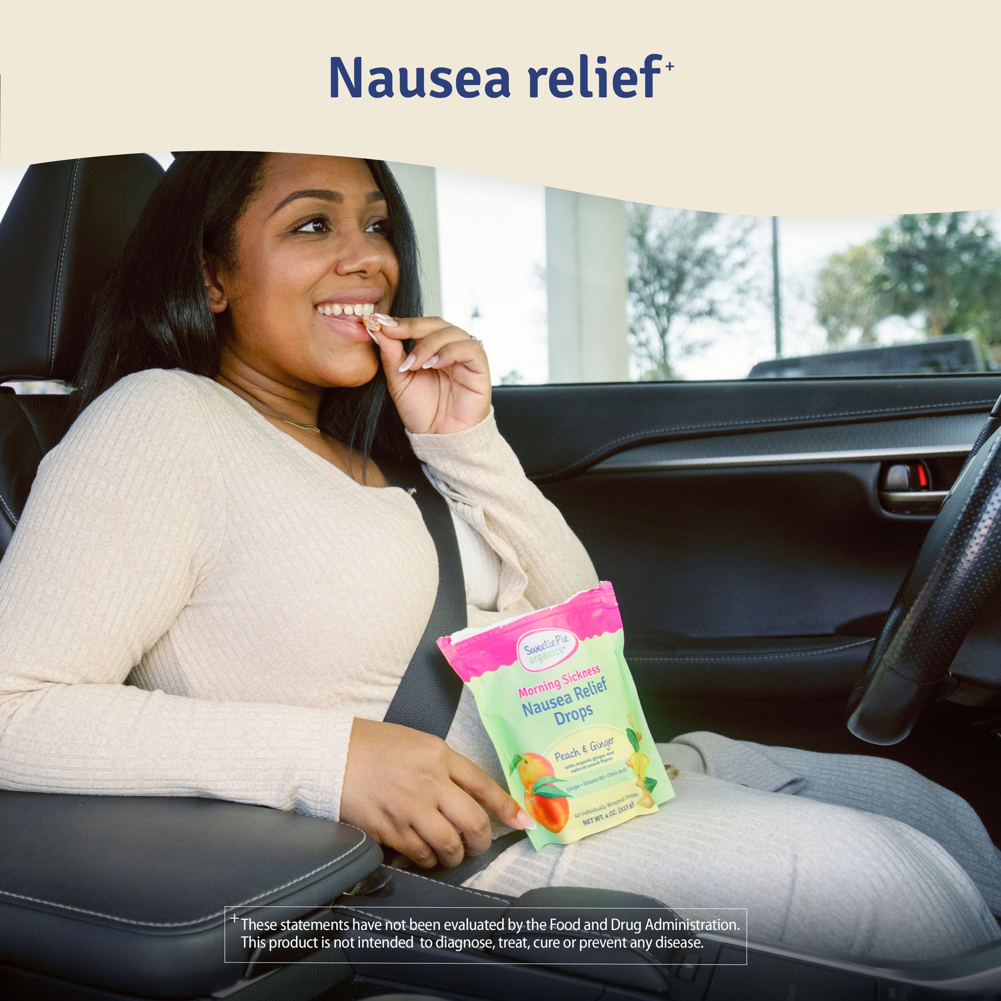 Pregnant mom-to-be in a car eating and holding bag of Sweetie Pie Morning Sickness Nausea Relief Drops